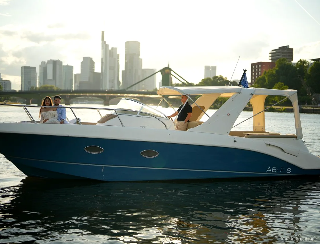 Couple on a romantic private boat cruise in Frankfurt with skyline views